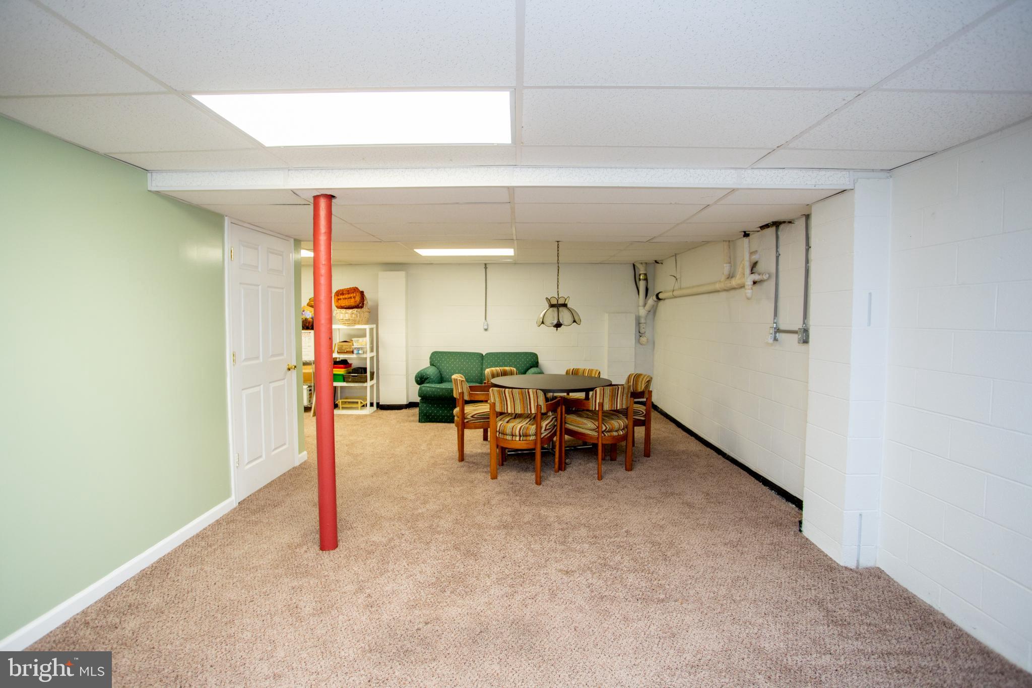 950 Camelot Road Furlong, PA 18925 - Photo 60 of 106 a living room with furniture and a table