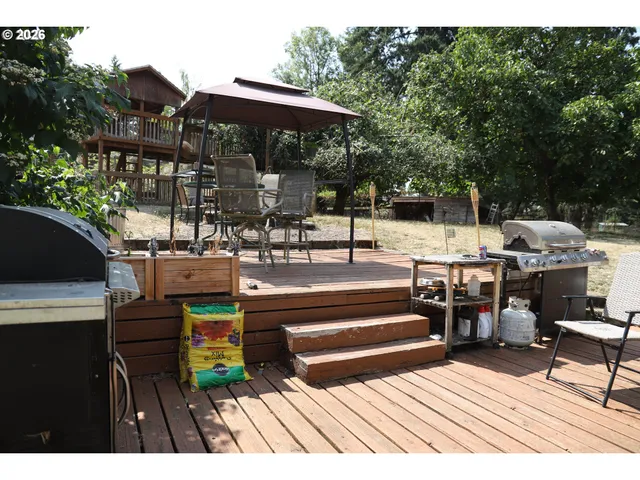 a view of outdoor space yard deck patio and outdoor kitchen