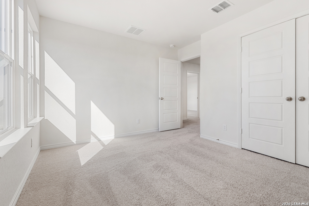 10045 Jagger Avenue Converse, TX 78109 - Photo 26 of 28 a view of an empty room with a window