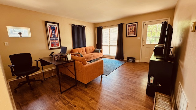 4614 Raintree Boulevard Austin, TX 78745 - Photo 2 of 14 a living room with furniture and a flat screen tv