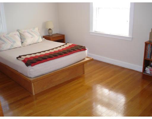 25 Goodnough Road Brookline, MA 02467 - Photo 6 of 7 a bedroom with a bed and window