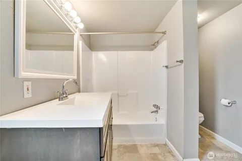 a bathroom with a bathtub and a sink
