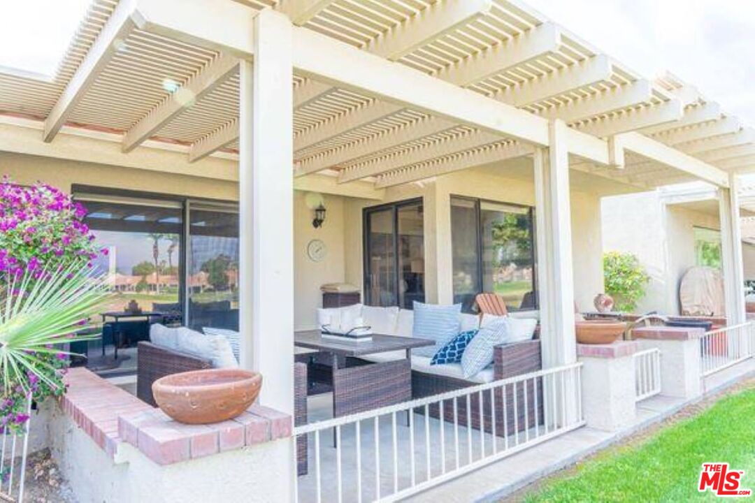 77116 Pauma Valley Way Palm Desert, CA 92211 - Photo 12 of 15 a outdoor living space with furniture and a potted plant