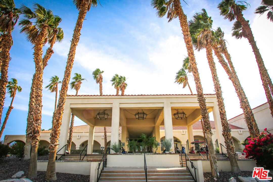 77116 Pauma Valley Way Palm Desert, CA 92211 - Photo 13 of 15 a view of a building with a tree in front