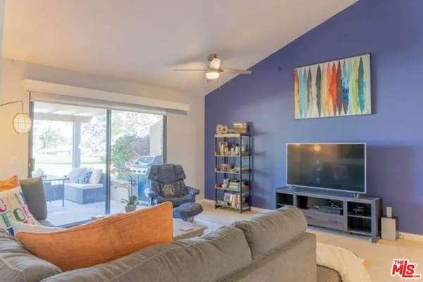 a living room with a couch and a flat screen tv