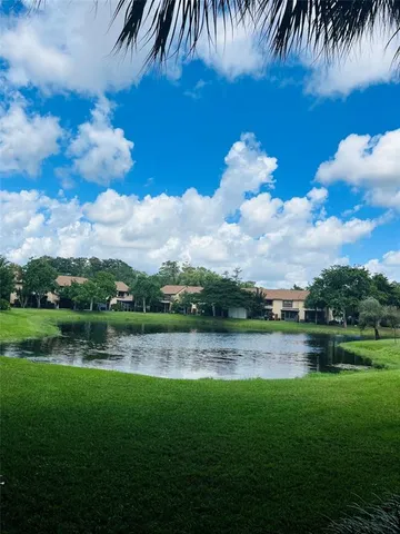 a view of a lake with a big yard