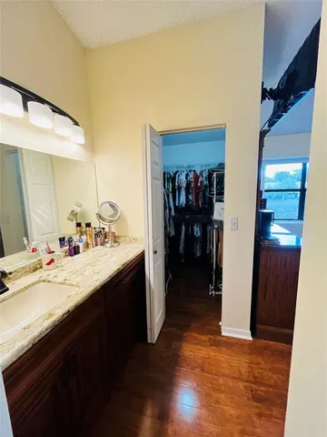 a kitchen with a sink and a refrigerator
