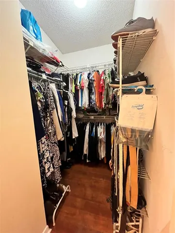 a view of a closet with storage