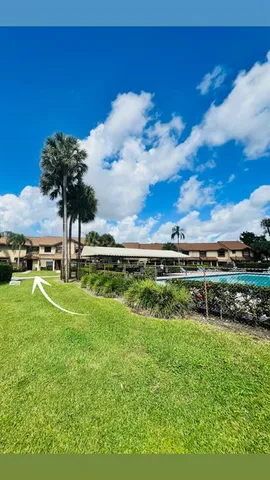 a view of a golf course with a lake view