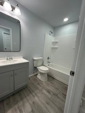 8411 10th Street Lubbock, TX 79416 - Photo 5 of 10 a spacious bathroom with a double vanity sink toilet and a mirror