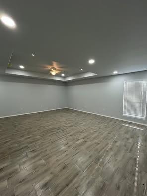 8411 10th Street Lubbock, TX 79416 - Photo 8 of 10 an empty room with wooden floor and windows