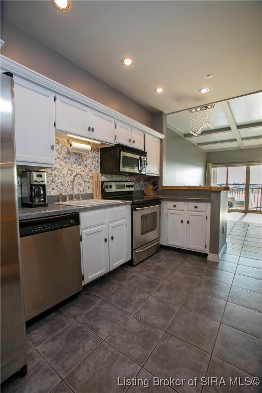 1 Riverpointe Plaza, Unit 820 Jeffersonville, IN 47130 - Photo 19 of 56 Kitchen opens to dining/living rooms with consistent flooring throughout.