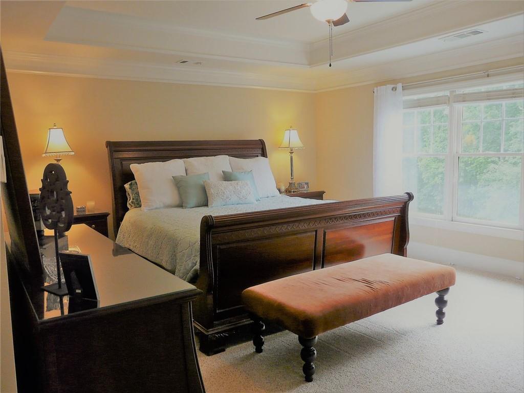 3970 Sweeting Street Cumming, GA 30041 - Photo 15 of 17 a bedroom with a bed and a table