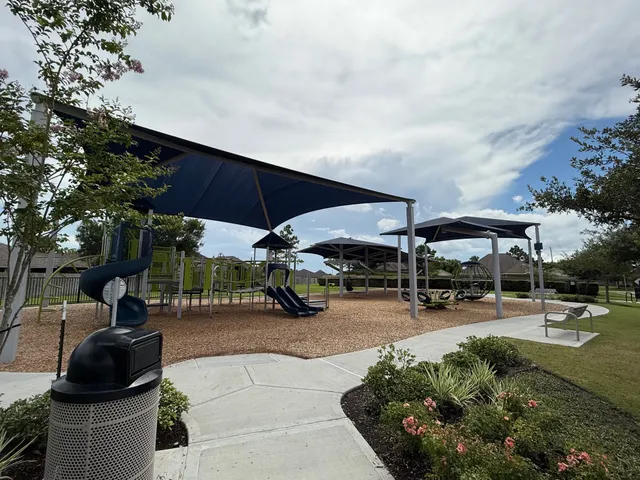 an outdoor space with patio and white umbrellas