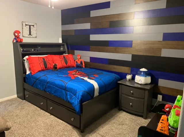 a bedroom with a bed and a dresser