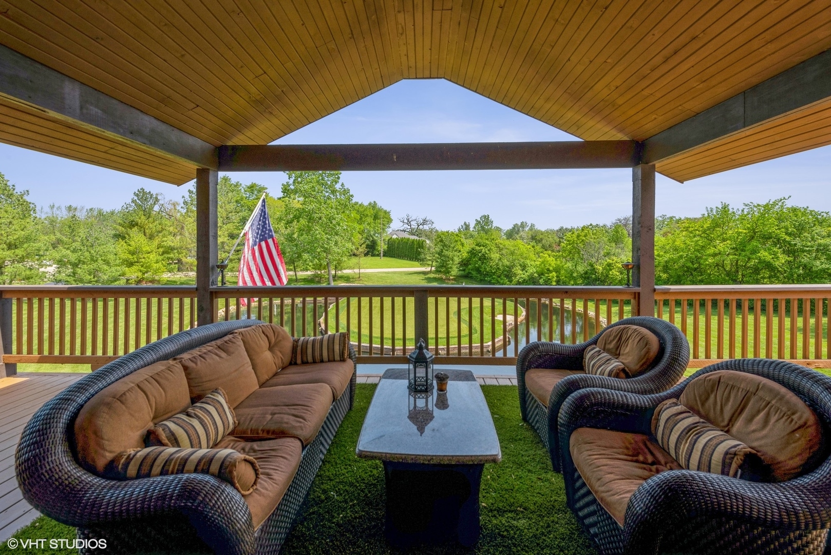 24717 West Caine Road Ingleside, IL 60041 - Photo 15 of 40 a view of a roof deck with couches chairs potted plants and a yard