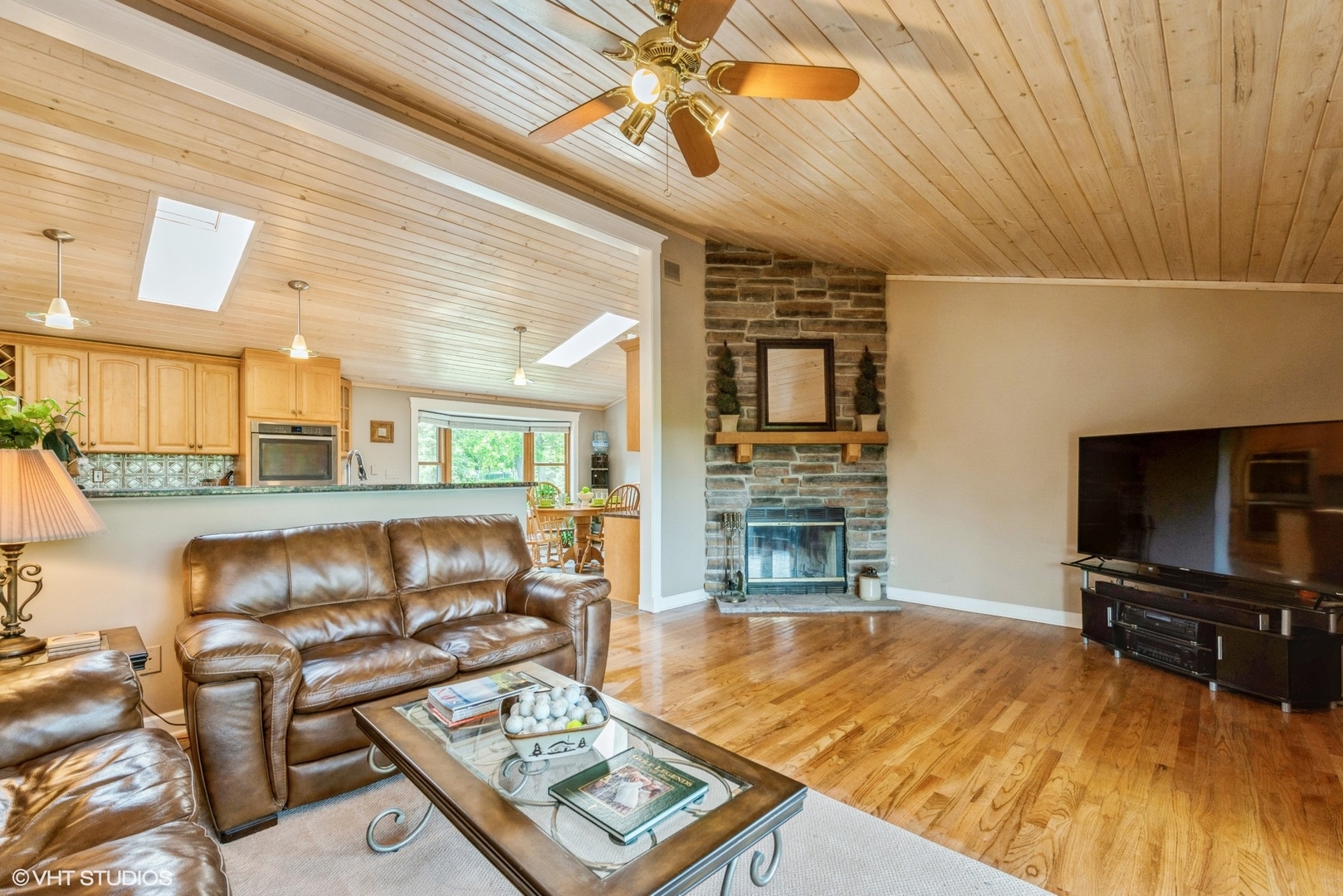 24717 West Caine Road Ingleside, IL 60041 - Photo 2 of 40 a living room with furniture a flat screen tv and a fireplace