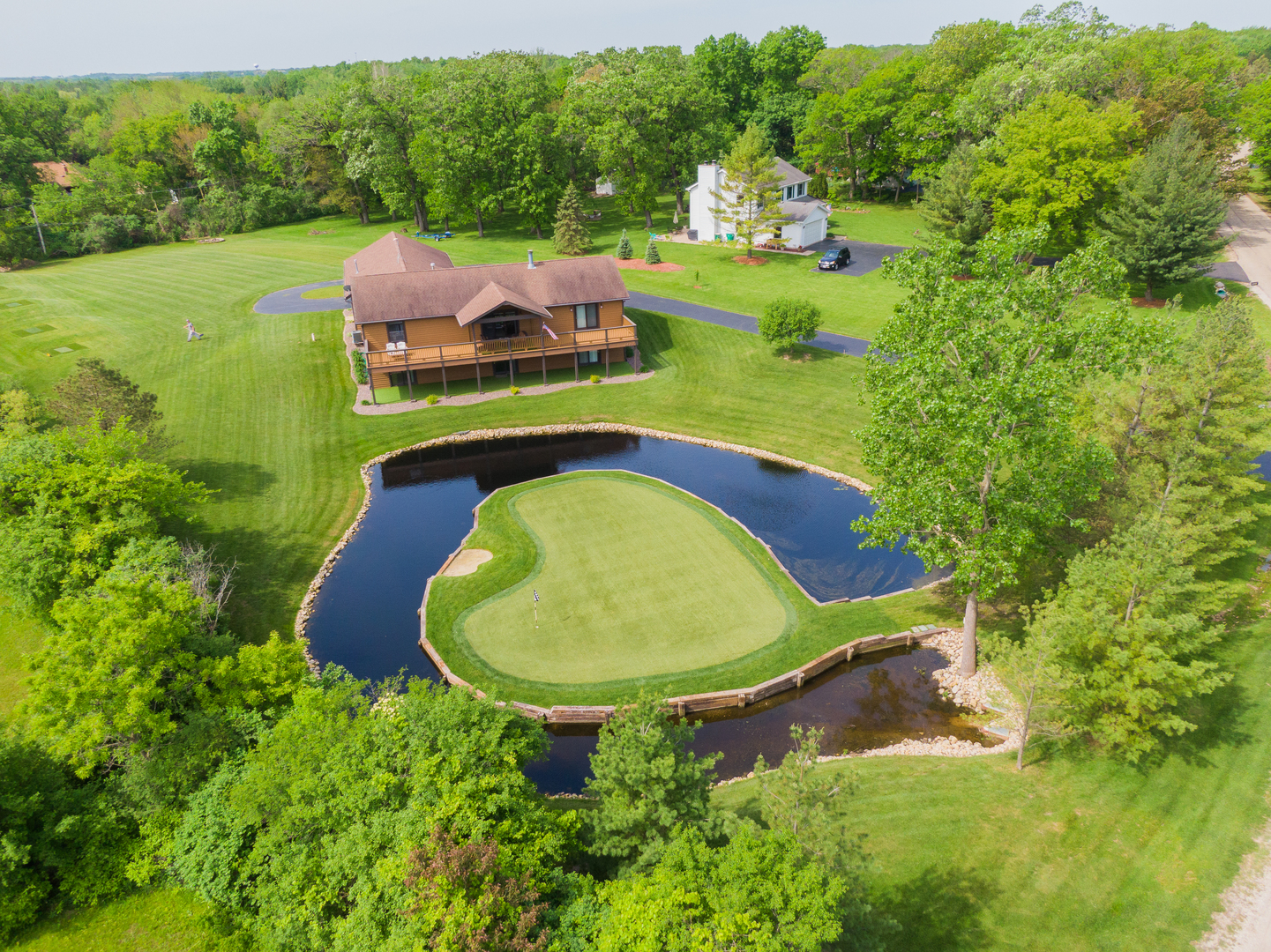 24717 West Caine Road Ingleside, IL 60041 - Photo 26 of 40 an aerial view of a house with garden space and street view