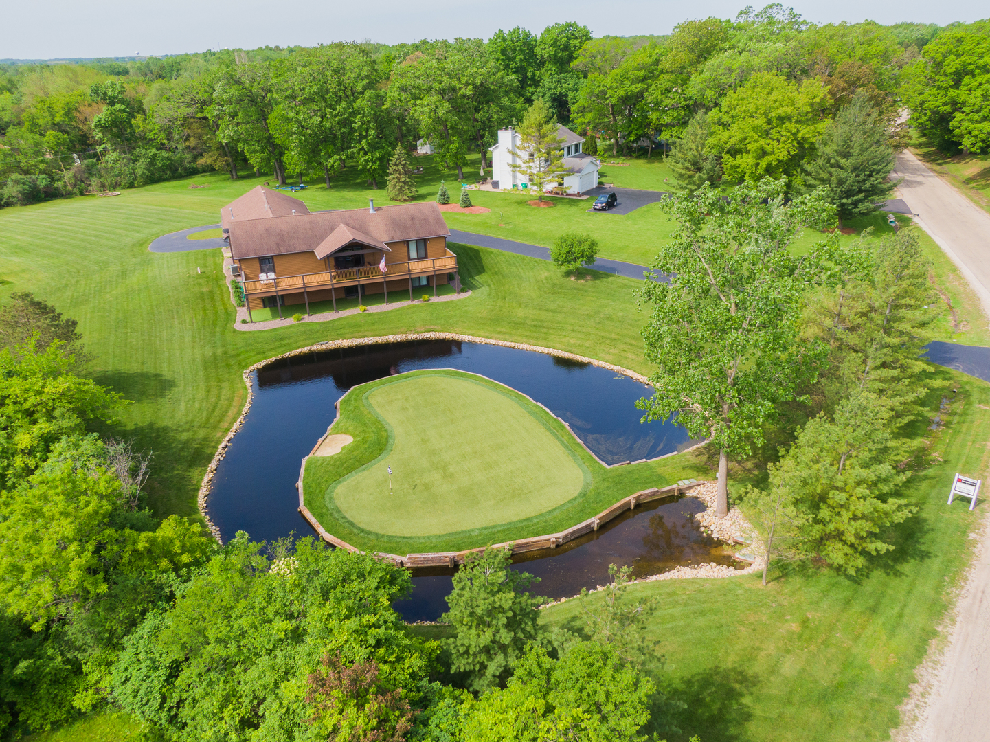24717 West Caine Road Ingleside, IL 60041 - Photo 27 of 40 an aerial view of a house with garden space and street view