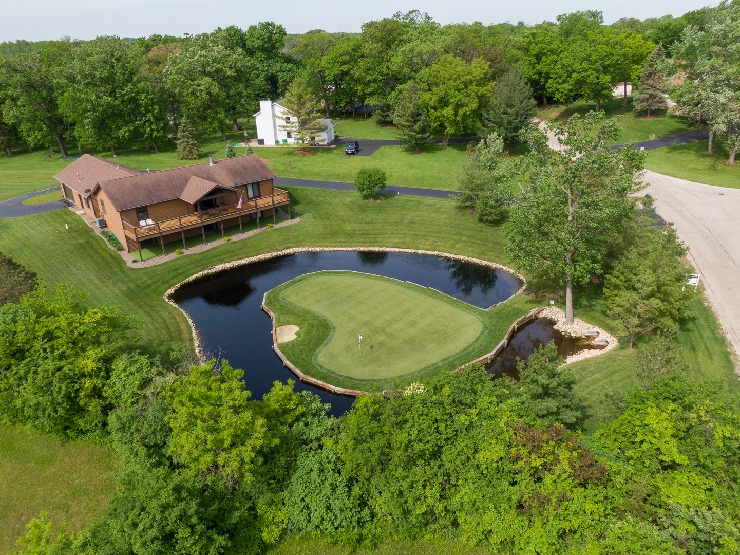 24717 West Caine Road Ingleside, IL 60041 - Photo 28 of 40 an aerial view of a house with swimming pool and green space