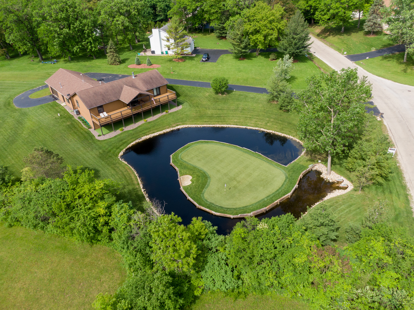 24717 West Caine Road Ingleside, IL 60041 - Photo 29 of 40 an aerial view of a house with garden space and street view