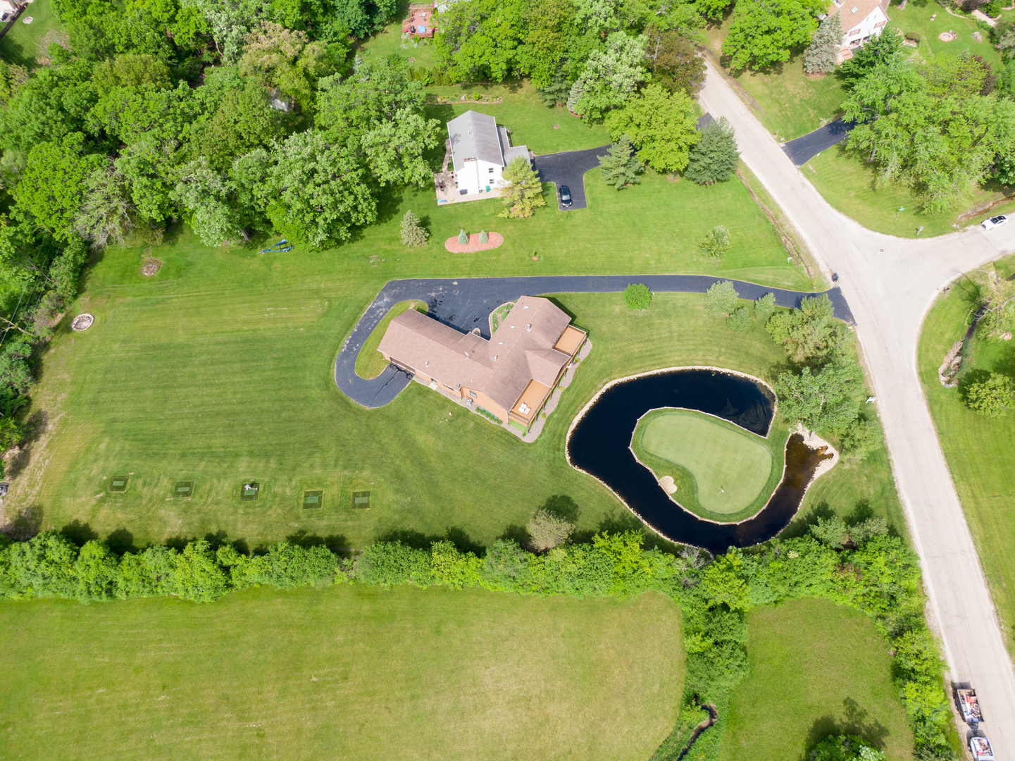 24717 West Caine Road Ingleside, IL 60041 - Photo 30 of 40 a view of a swimming pool with a yard