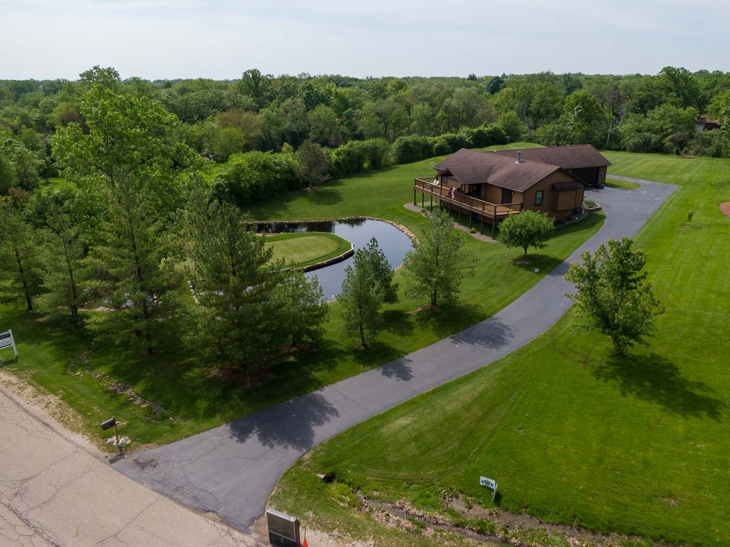 24717 West Caine Road Ingleside, IL 60041 - Photo 33 of 40 an aerial view of a house with a garden