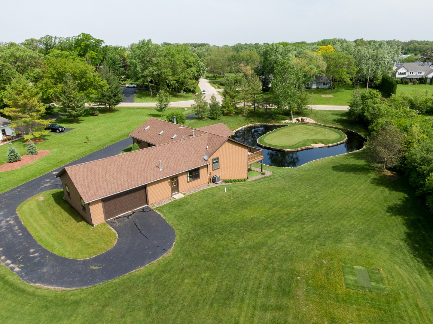 24717 West Caine Road Ingleside, IL 60041 - Photo 36 of 40 an aerial view of a house with garden space and street view