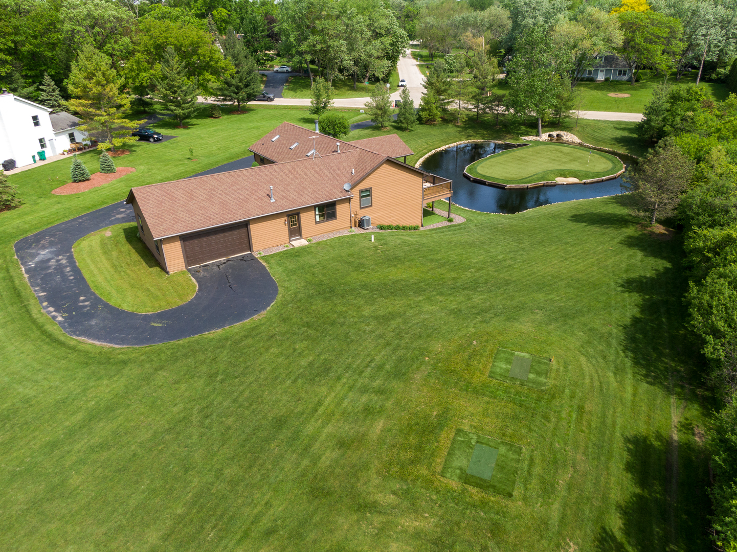 24717 West Caine Road Ingleside, IL 60041 - Photo 38 of 40 an aerial view of a house with garden space and street view