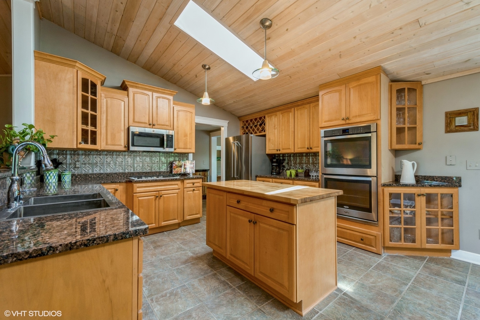 24717 West Caine Road Ingleside, IL 60041 - Photo 4 of 40 a kitchen with stainless steel appliances granite countertop a stove top oven a sink a counter space and cabinets