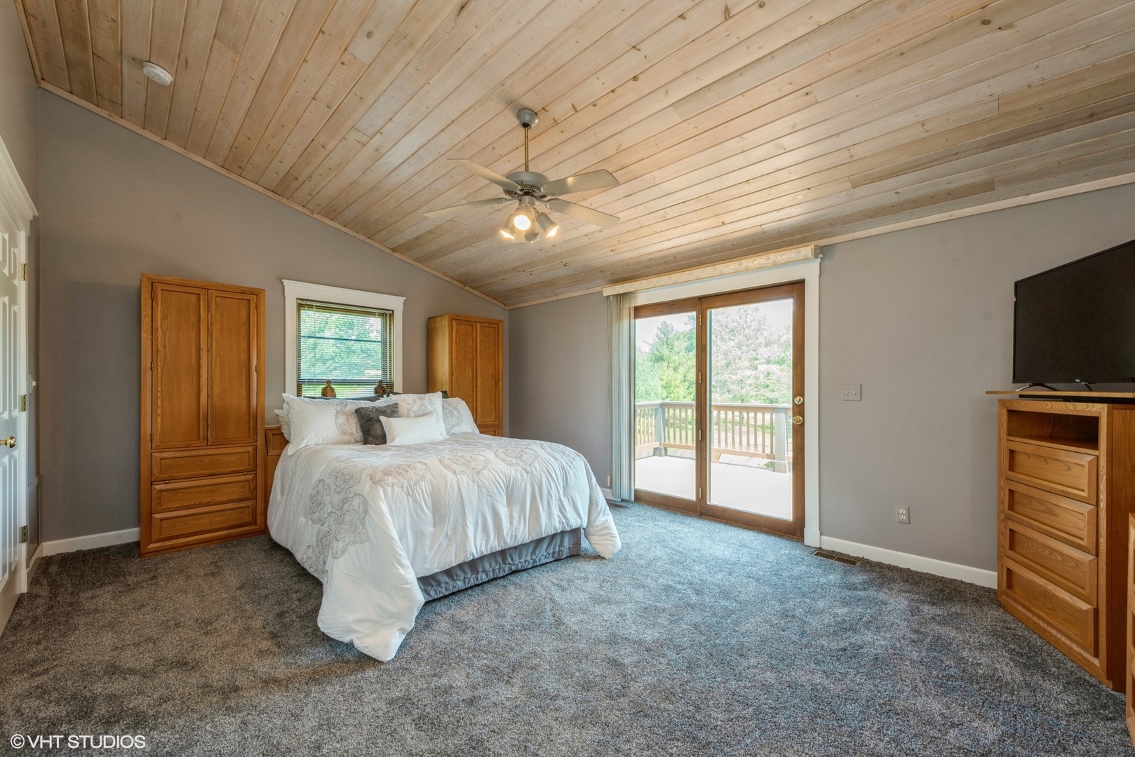 24717 West Caine Road Ingleside, IL 60041 - Photo 7 of 40 a spacious bedroom with a bed and a flat screen tv