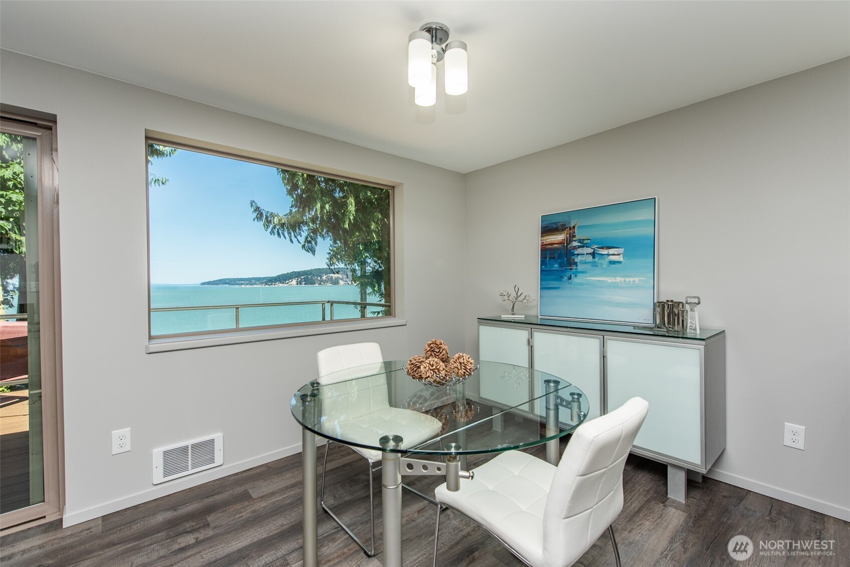 681 Bachelor Road Sequim, WA 98382 - Photo 8 of 39 a view of a dining room with furniture wooden floor and a chandelier