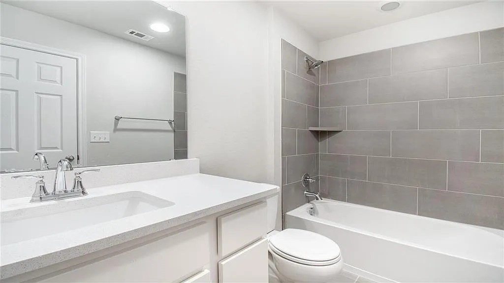 317 Capstone Road Liberty Hill, TX 78642 - Photo 5 of 10 Bathroom with shower combination, vanity, and recessed lighting