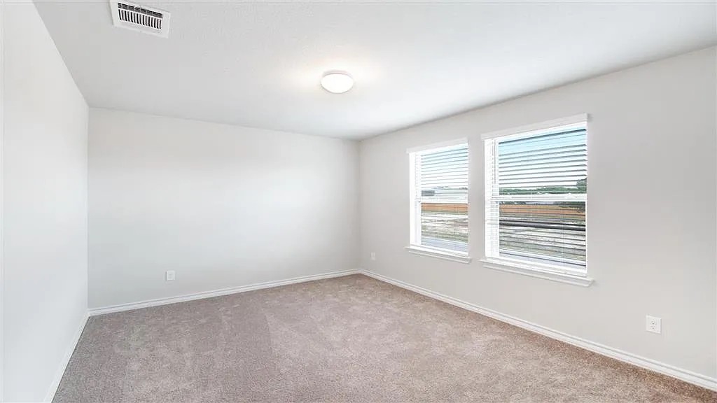 317 Capstone Road Liberty Hill, TX 78642 - Photo 7 of 10 Carpeted empty room featuring baseboards