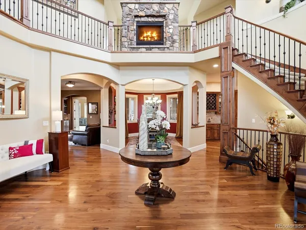 a view of a livingroom with furniture staircase and a kitchen