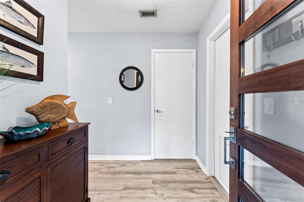 29 Pelican Lane Edgewater, FL 32141 - Photo 3 of 39 a view of entryway with wooden floor