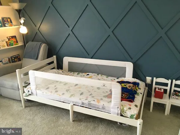 a bed room with a bed and a window