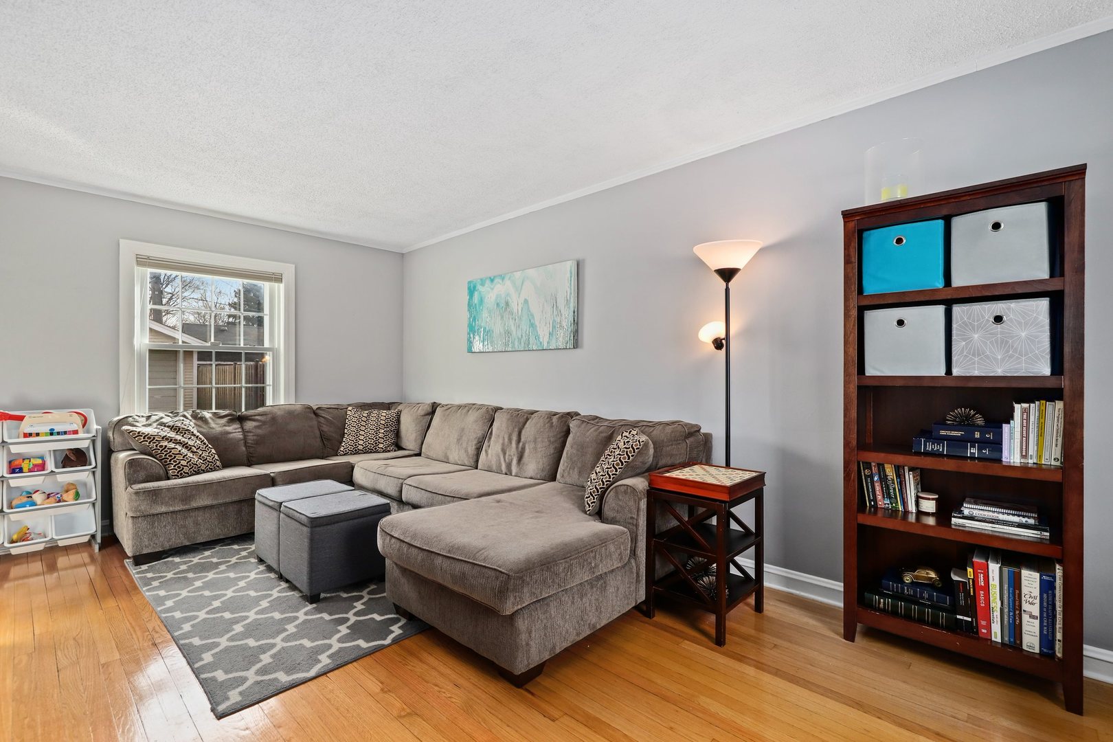 5815 North Canfield Avenue Chicago, IL 60631 - Photo 11 of 31 a living room with furniture and a book shelf