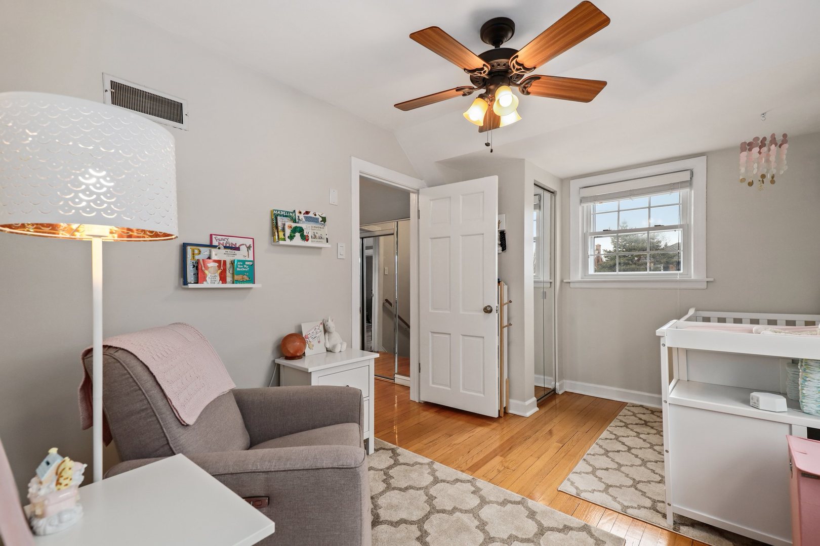 5815 North Canfield Avenue Chicago, IL 60631 - Photo 18 of 31 a living room with furniture and a chandelier