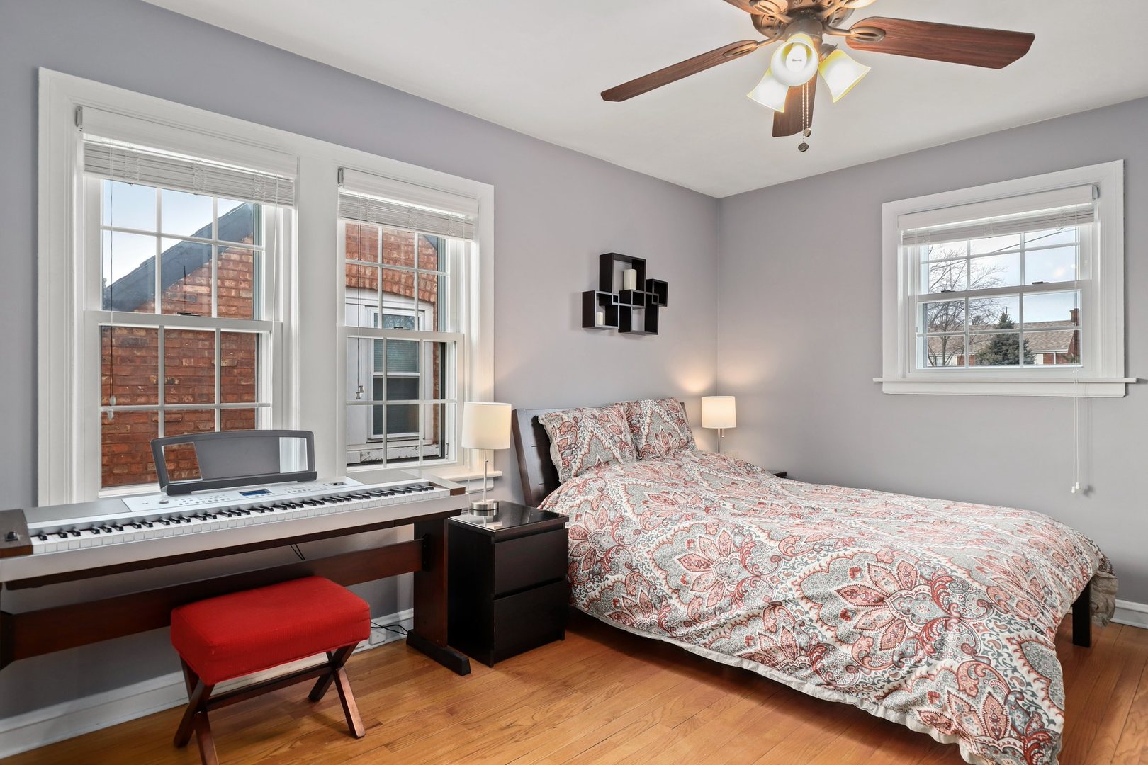 5815 North Canfield Avenue Chicago, IL 60631 - Photo 19 of 31 a bedroom with a bed dresser and a window