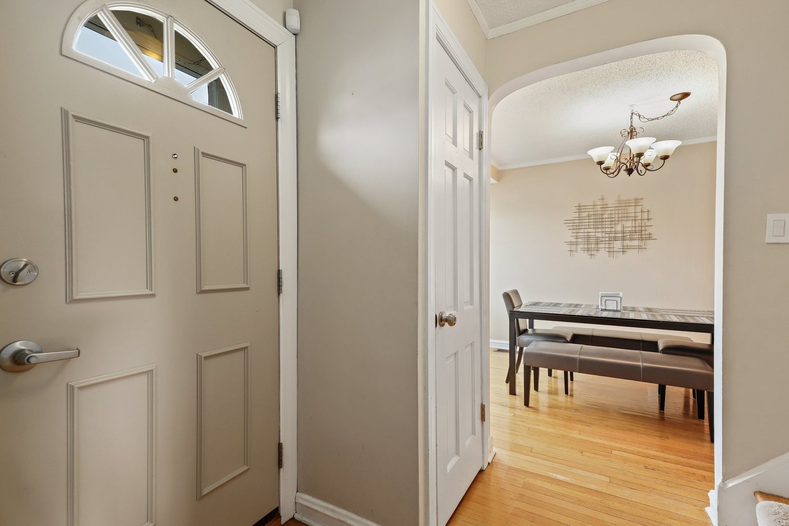 5815 North Canfield Avenue Chicago, IL 60631 - Photo 22 of 31 a view of a hallway with wooden floor windows and entryway