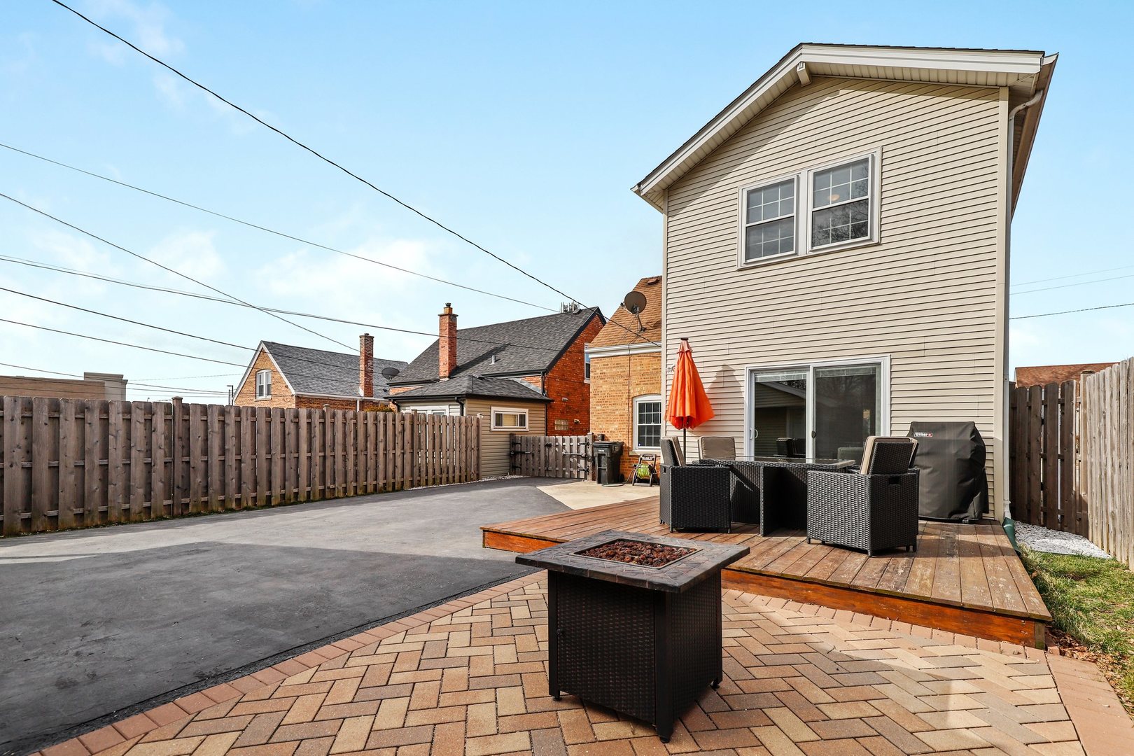 5815 North Canfield Avenue Chicago, IL 60631 - Photo 25 of 31 a backyard of a house with fire pit and couch