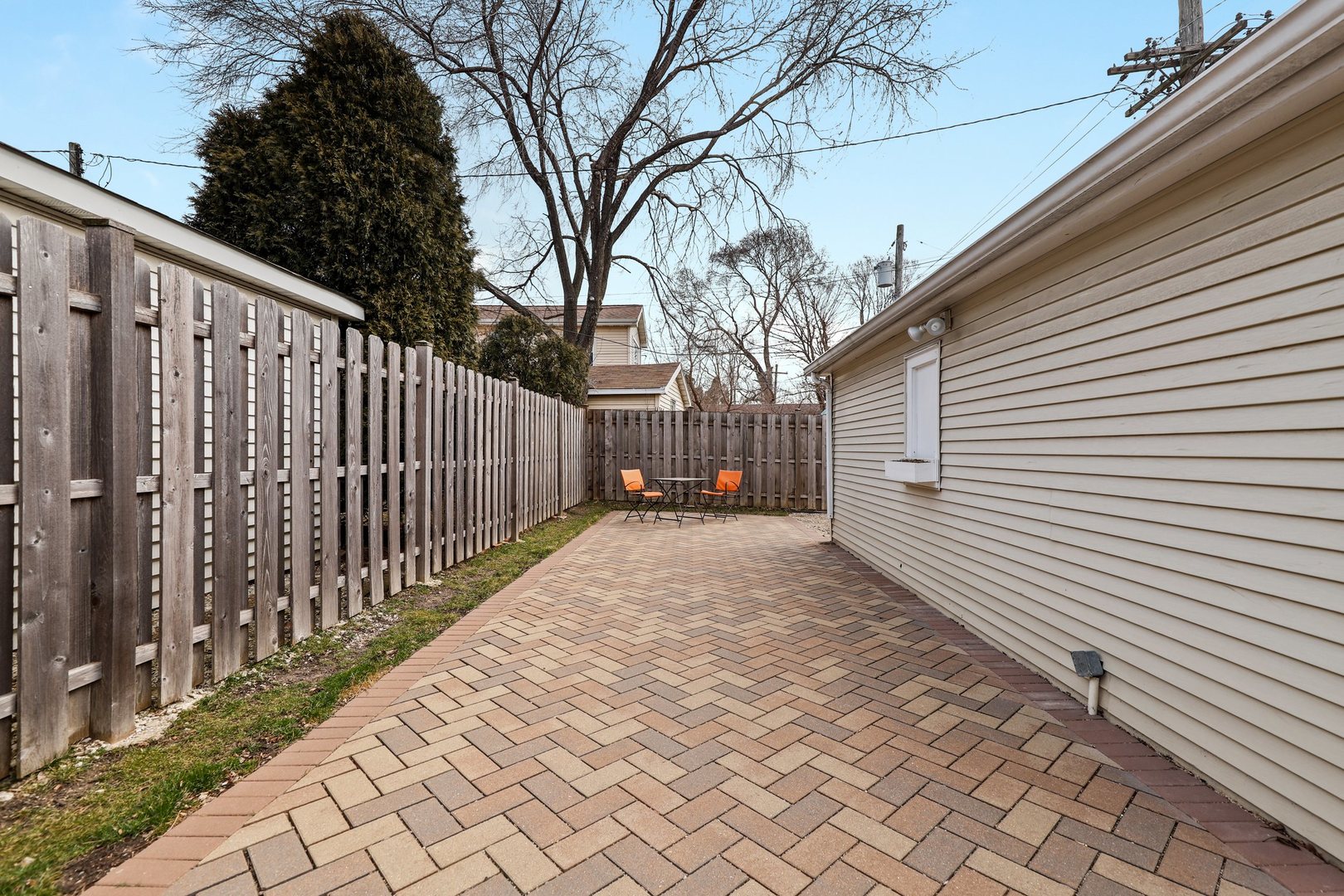 5815 North Canfield Avenue Chicago, IL 60631 - Photo 28 of 31 a view of a backyard with wooden fence