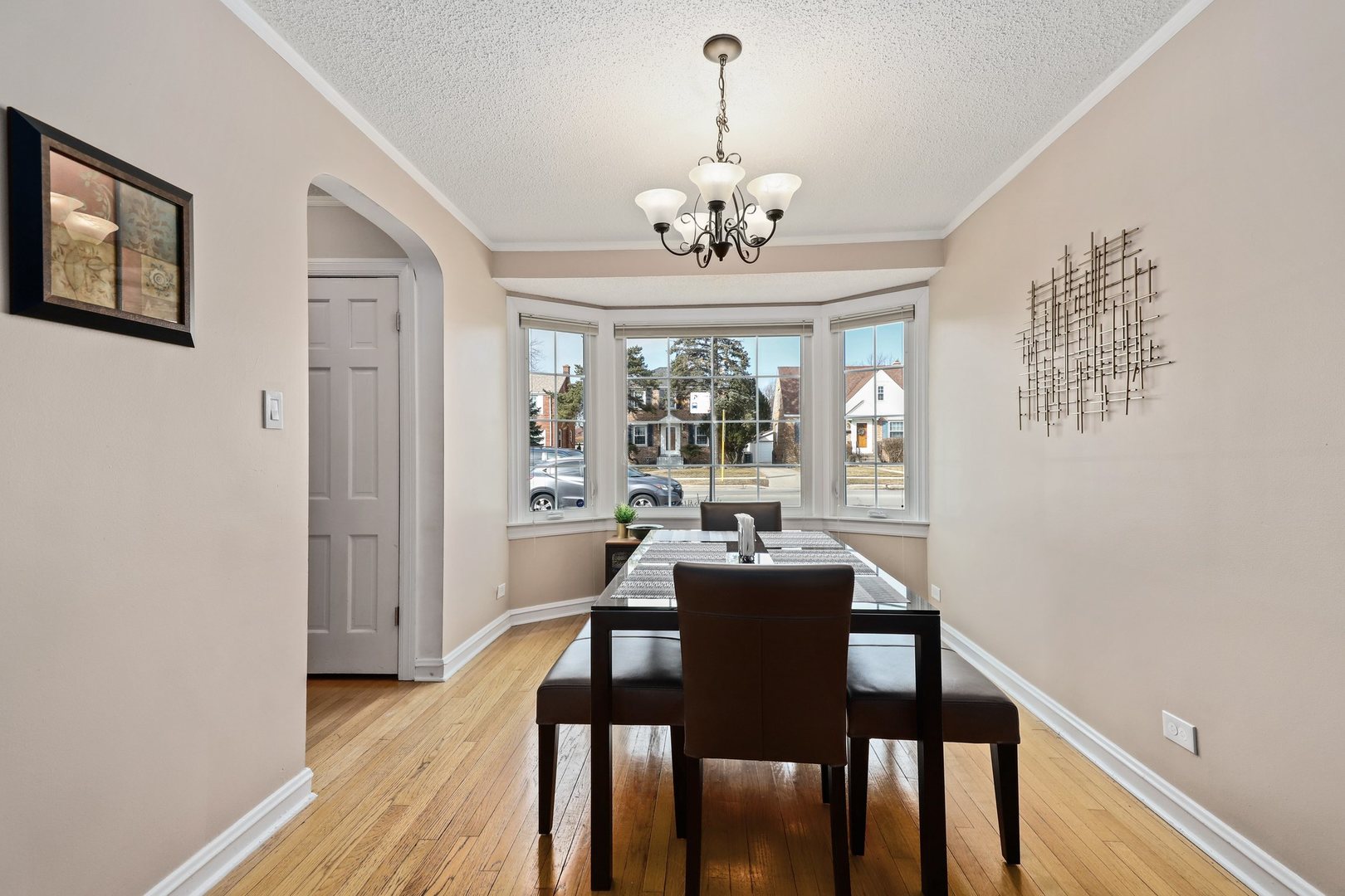 5815 North Canfield Avenue Chicago, IL 60631 - Photo 8 of 31 a view of a dining room with furniture wooden floor and chandelier