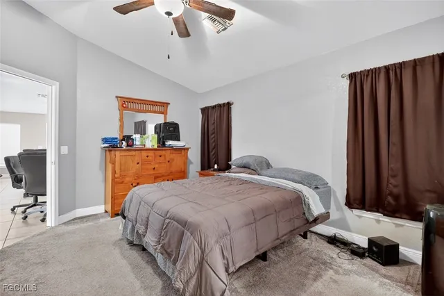 a bathroom with a shower curtain and a bathtub