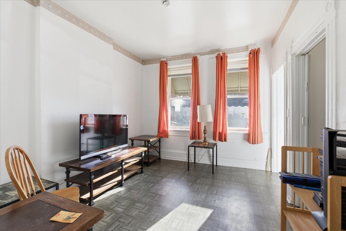 516 West 45th Place Chicago, IL 60609 - Photo 2 of 12 a living room with furniture and a flat screen tv