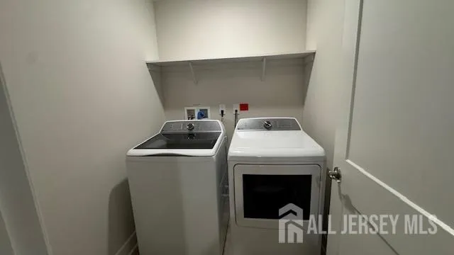a view of room with stairs and a wooden floor