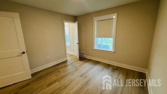 a view of an empty room and a window