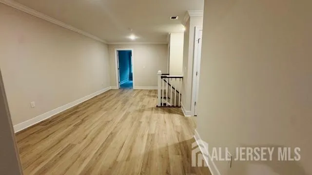 a view of walk in closet with empty racks