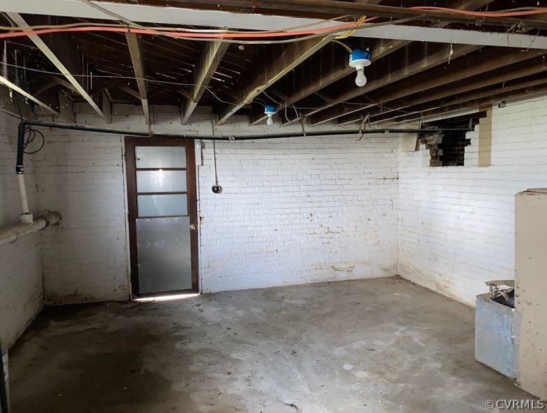 2311 Goodes Bridge Road Richmond, VA 23224 - Photo 24 of 31 Unfinished Lower Level w/ Rear Door